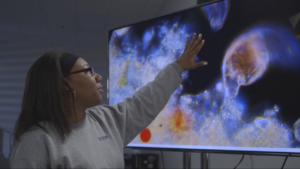 A woman pointing the screen.