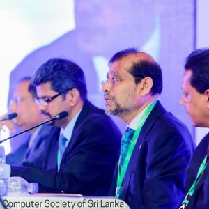 A picture of four men in the panel discussion. 