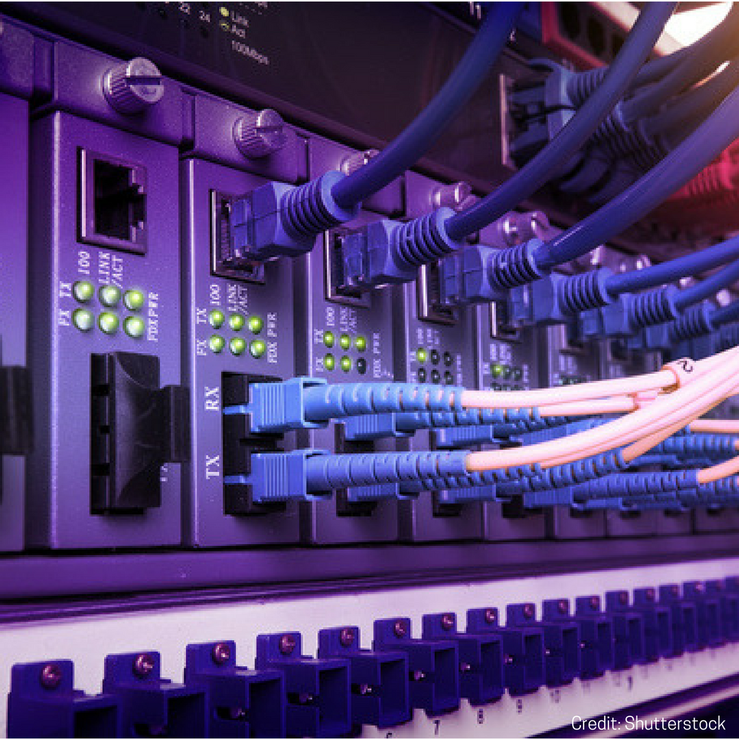A picture of computer cables inserted into a component.