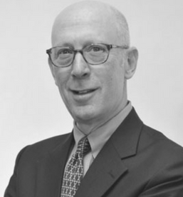 A headshot of Ira Fuchs.