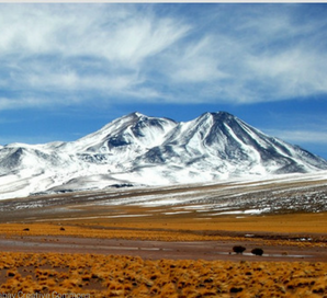 A picture of mountain covered with snow. 