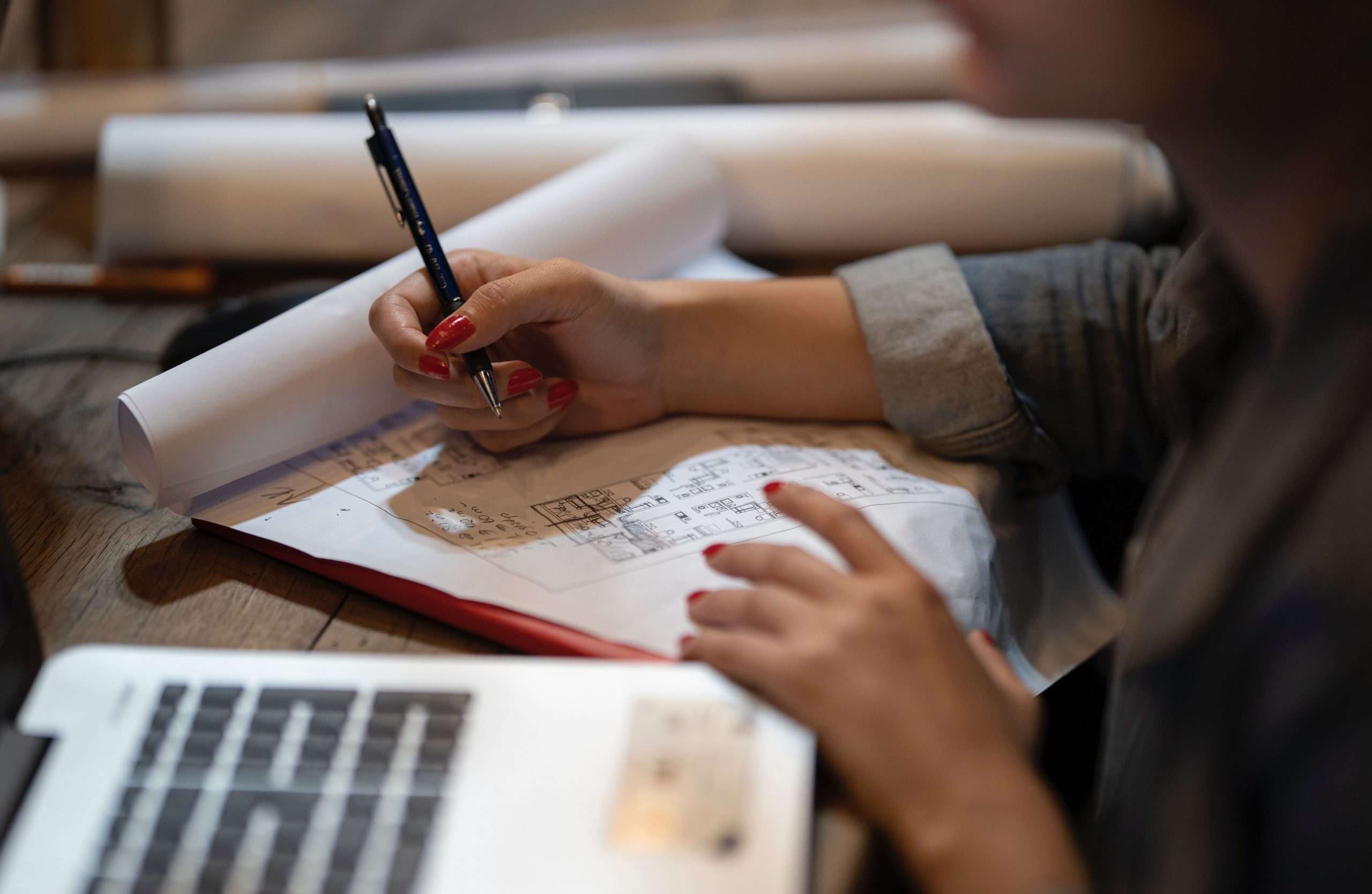 person writing with a pen