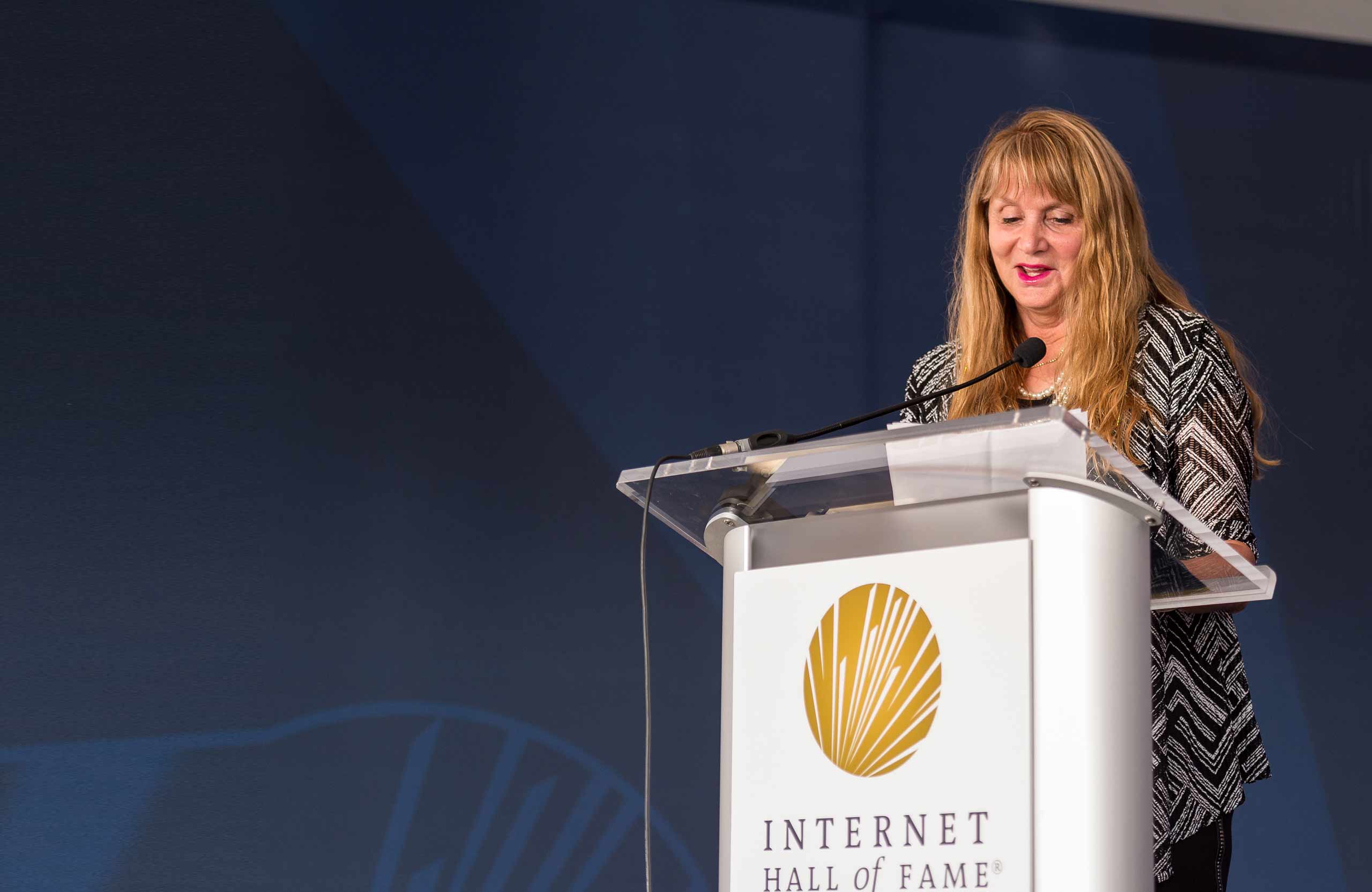 a woman on the stage talking