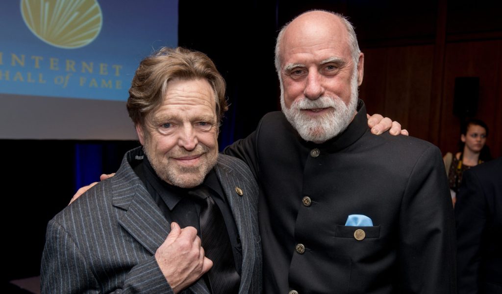 two men posing at a ceremony