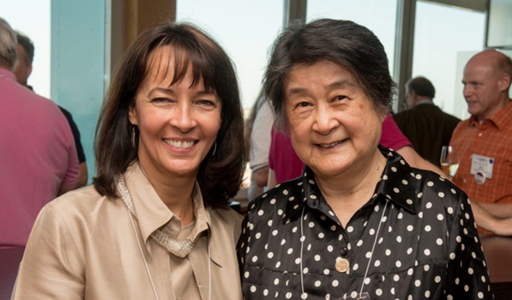 two women smiling In ceremony