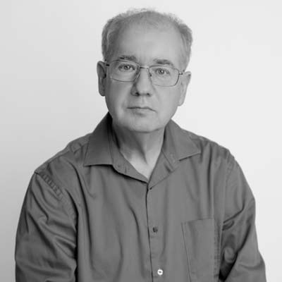 a man in a shirt, wearing glasses
